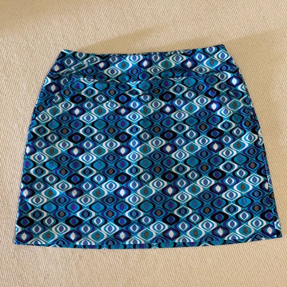 Kate Lord turquoise, purple, black print golf skorts